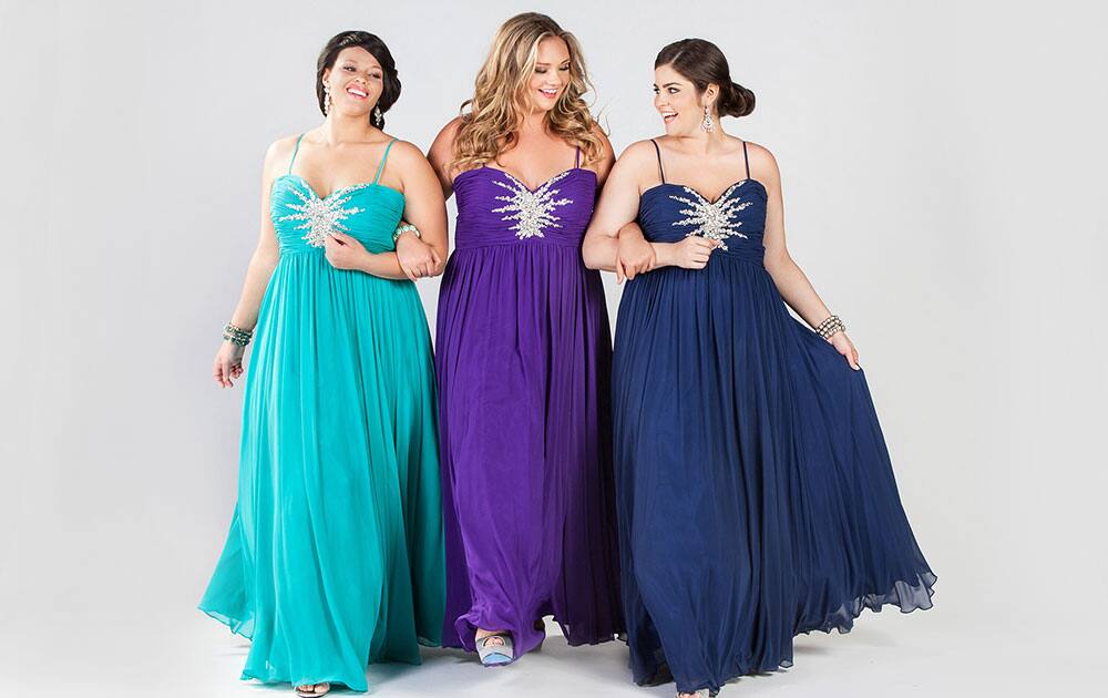 This product image released by Sydney’s Closet shows women modeling plus size prom dresses.