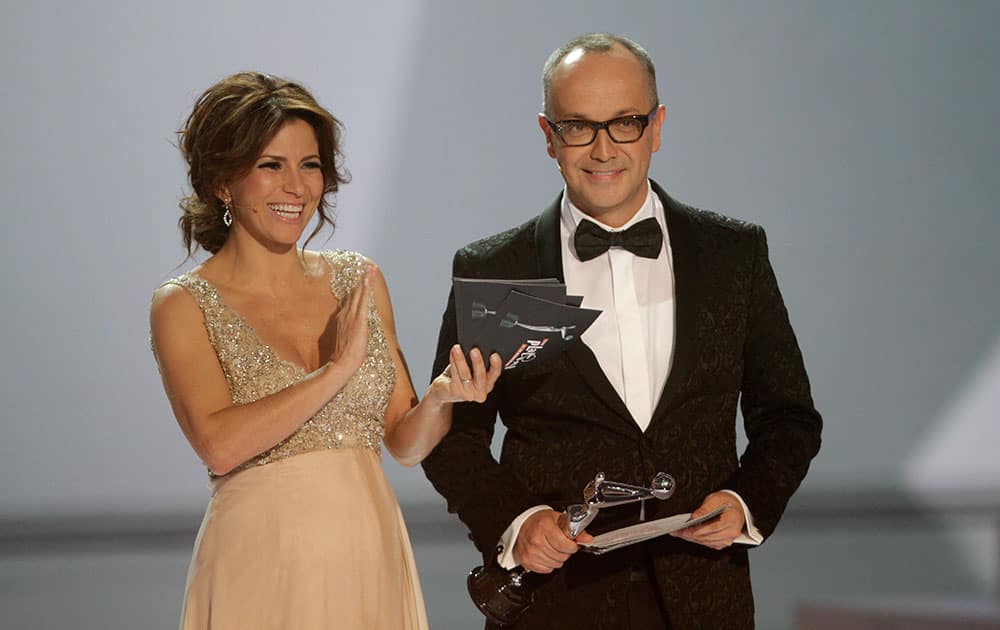 Colombia's entertainment journalist Juan Carlos Arciniega, right, and Mexican singer and actress Alessandra Rosaldo host the first edition of the Platino Ibero-American Cinema Awards at the Anayansi theater in Panama City.