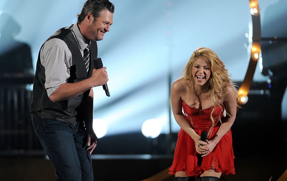 Blake Shelton, left, and Shakira perform on stage at the 49th annual Academy of Country Music Awards at the MGM Grand Garden Arena in Las Vegas.