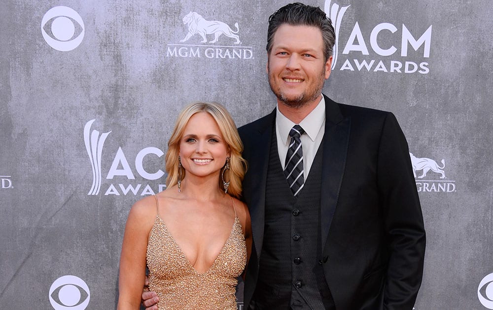 Miranda Lambert, left, and Blake Shelton arrive at the 49th annual Academy of Country Music Awards at the MGM Grand Garden Arena in Las Vegas.