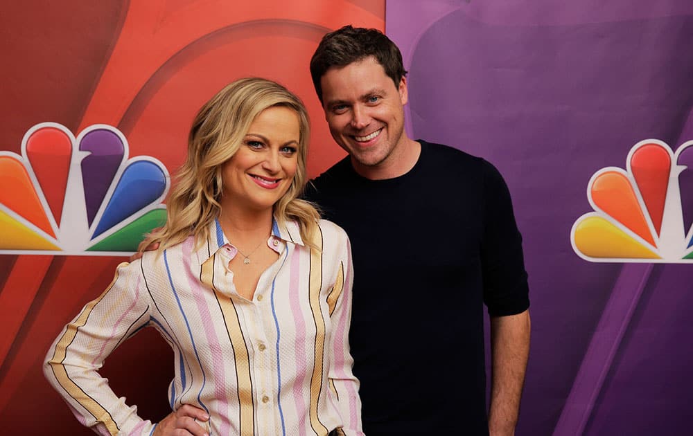 This photo released by NBC shows Amy Poehler, left, and Greg Poehler, from the new TV series, `Welcome to Sweden` during NBCUniversal Summer Press Day in Pasadena, Calif. 