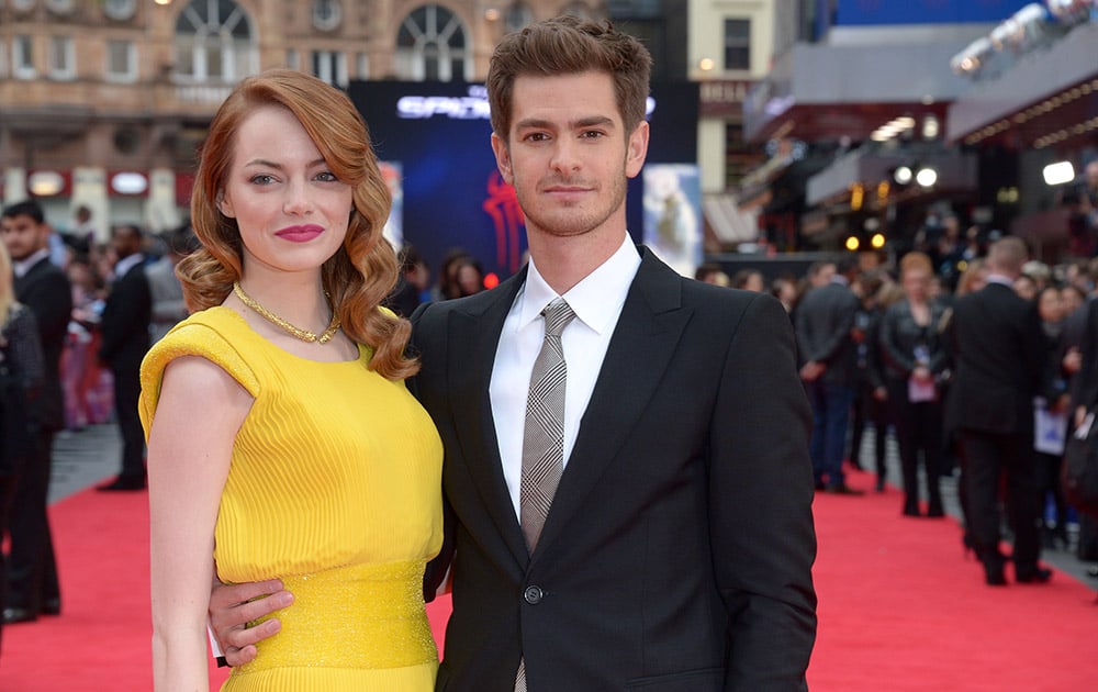 US actress Emma Stone and British actor Andrew Garfield pose for photographers as they arrive on the red carpet for the world premiere of The Amazing Spider-Man 2 in Leicester Square, London.