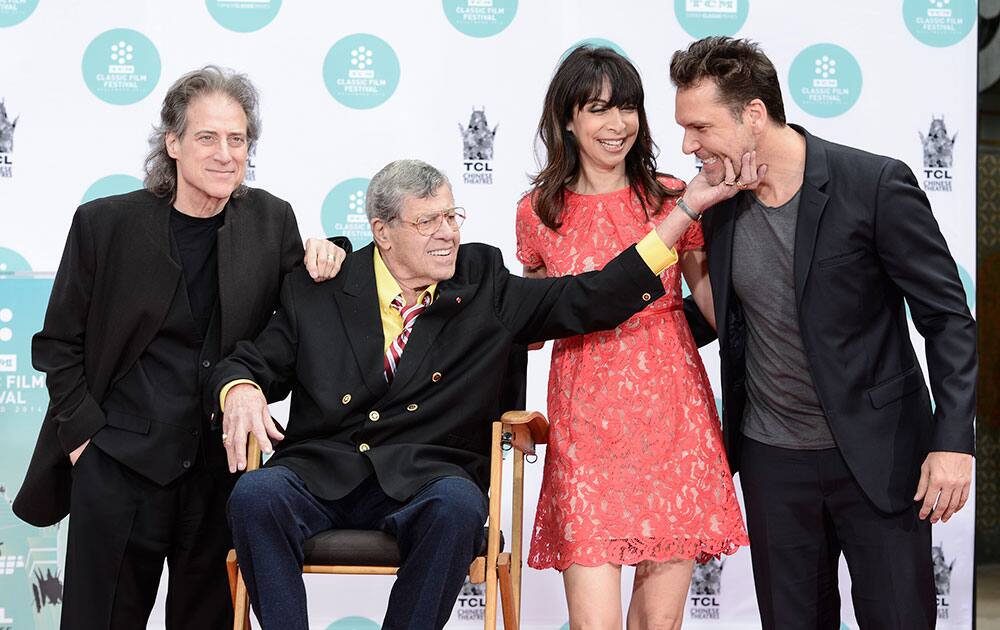 From left to right, actor and comedian Richard Lewis, actor and comedian Jerry Lewis, actress Illeana Douglas, and actor and comedian Dane Cook pose together as Jerry Lewis is honored with a hand and footprint ceremony at TCL Chinese Theatre in Los Angeles. 