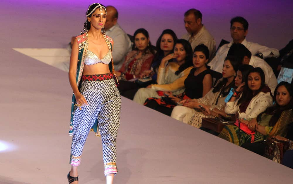 A model displays creation by designer Karma Pink at a fashion show organized by the Pakistan Fashion Designers Council in Lahore.