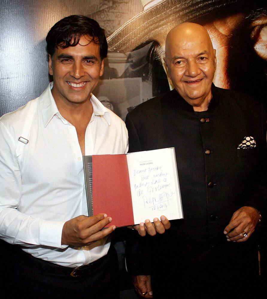 Actor Akshay Kumar during the launch of 'Prem Naam Hai Mera, Prem Chopra' a biography on Veteran actor Prem Chopra (R) in Mumbai.