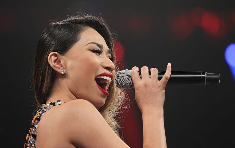 Entertainer Jessica Sanchez sings the Philippine national anthem before the WBO welterweight title boxing fight between Manny Pacquiao and Timothy Bradley  in Las Vegas. 