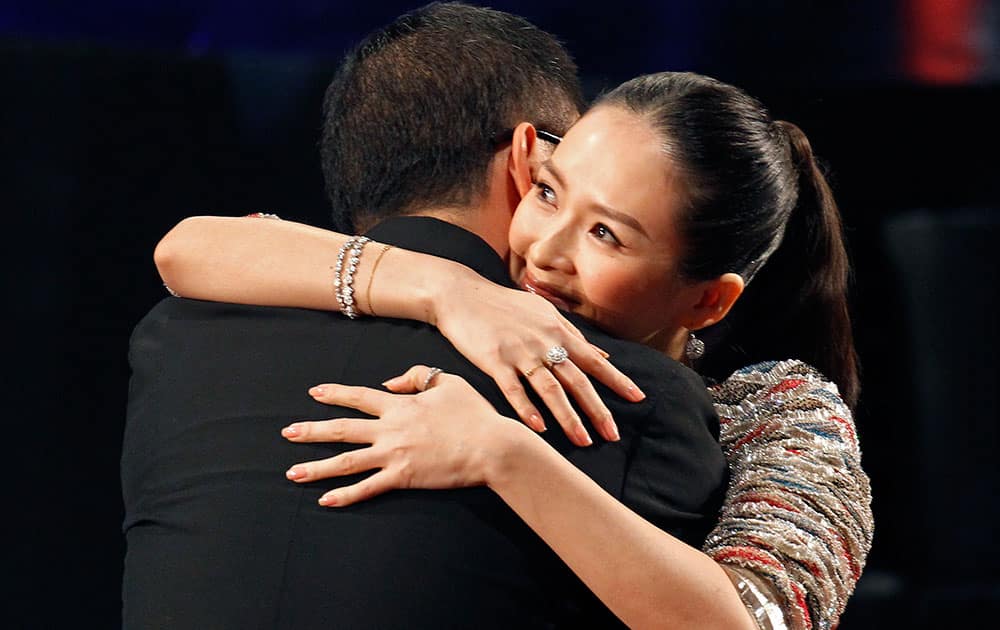 Chinese actress Zhang Ziyi, right, celebrates with Hong Kong director Wong Kar Wai after winning the Best Actress award for her role in the movie ' The Grandmaster ' at the at the 33rd Hong Kong Film Awards.