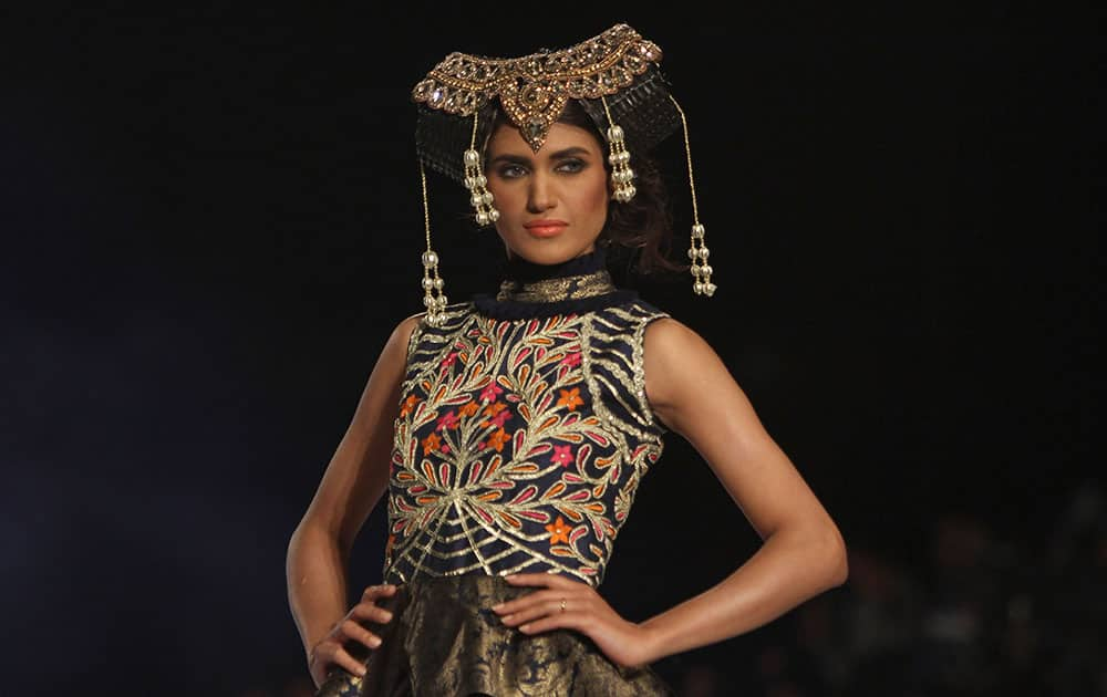 A model displays a creation by designer Akif Mahmood at a fashion show organized by the Pakistan Fashion Designers Council in Lahore.