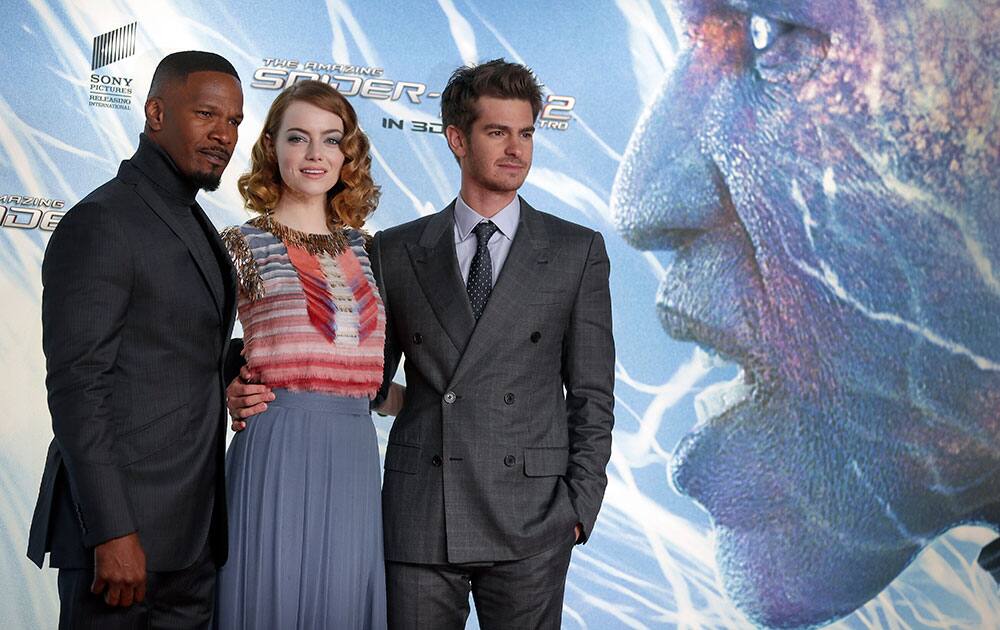 US actress Emma Stone, center, British actor Andrew Garfield, right, and U.S actor Jamie Foxx, left, pose for the media during the Germany premiere of the movie 'The Amazing Spider-Man 2' in Berlin.