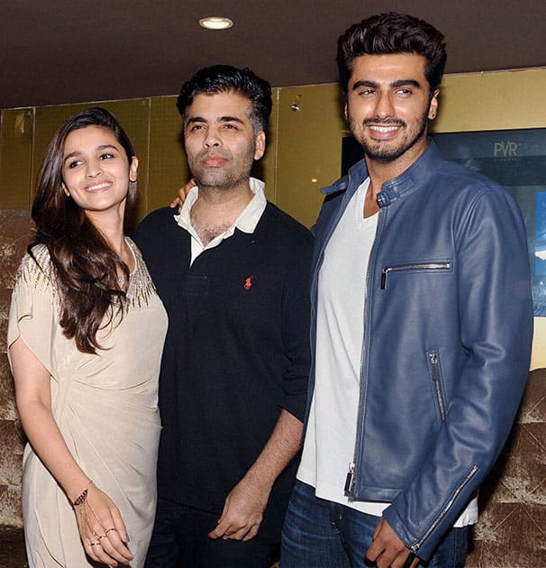 Bollywood director Karan Johar, actors Alia Bhatt and Arjun Kapoor during the promotion of their film '2 States’ at a movie hall in Mumbai.