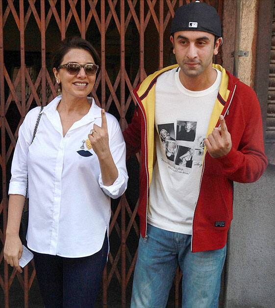 Bollywood actor Ranbir Kapoor and his mother Nitu Singh display their inked fingers after casting votes for Lok Sabha polls in Mumbai.