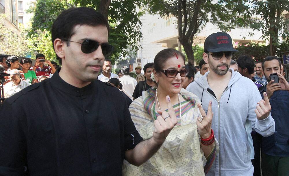Bollywood actor Shatrughan Sinha's wife Poonam and sons Luv and Kush after casting their votes for Lok Sabha elections in Mumbai.
