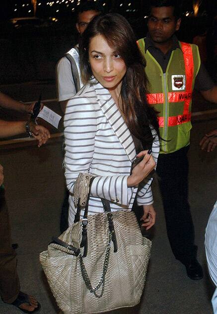 Malaika Arora departs from Mumbai's CST International Airport for Florida, USA to take part in IIFA 2014 awards ceremony.