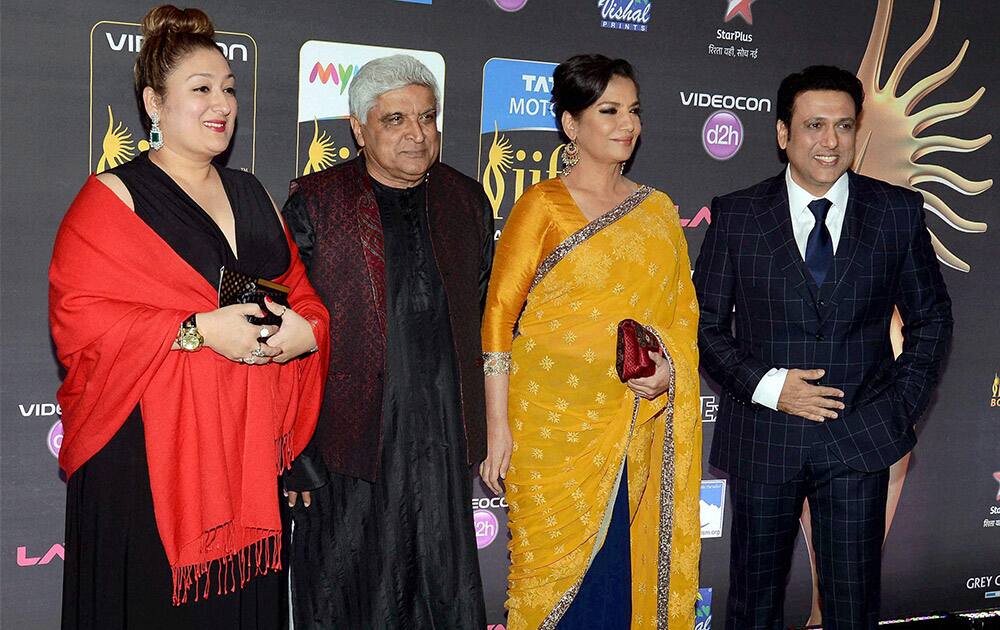 Bollywood lyricist Javed Akhtar, actress Shabana Azmi, actor Govinda and his wife Sunita (L) at International Indian Film Academy (IIFA) function in Florida.