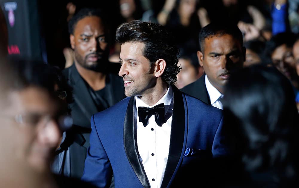 Hrithik Roshan walks the green carpet as he arrives for the 15th annual International Indian Film Awards in Tampa, Fla.