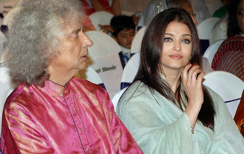 Aishwarya Rai Bachchan with Santoor player Pandit Shiv Kumar Sharma during a musical concert in Mumbai.