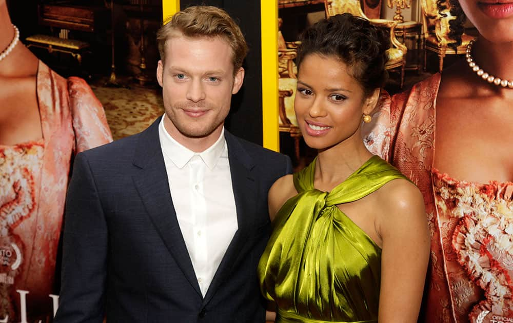 Actor Sam Reid, left, and actress Gugu Mbatha-Raw, right, attend the New York premiere of `Belle`in New York.