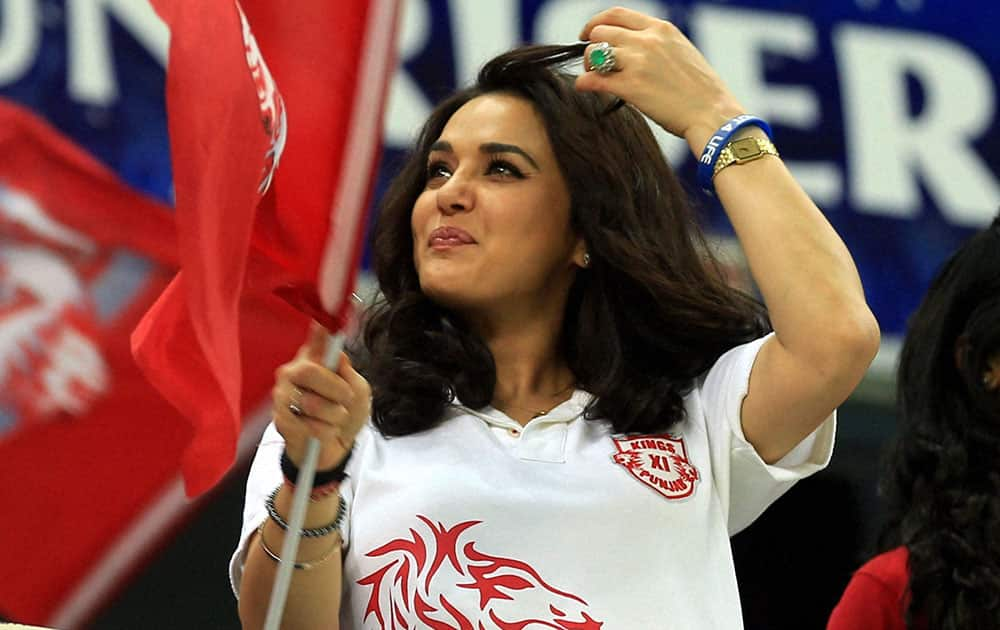 Preity Zinta co-owner of Kings XI Punjab watches her team's match against Royal Challengers Bangalore in Dubai.