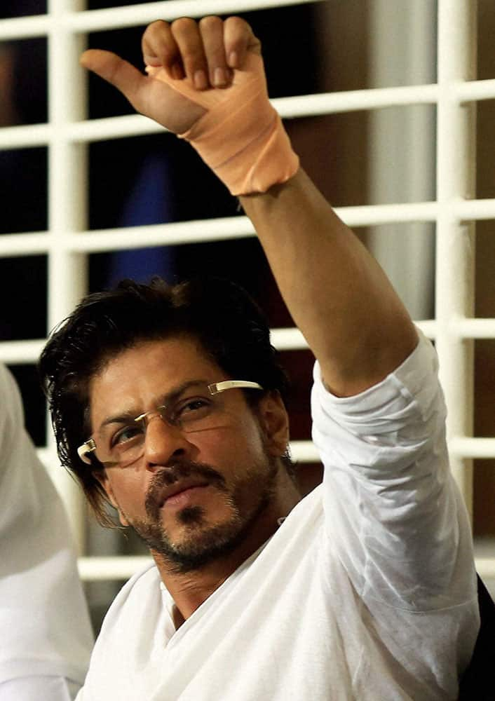 Sharaukh Khan owner of Kolkatta Knight Riders waves during an IPL 7 match in Abu Dhabi.