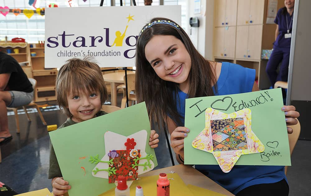 Actress Bailee Madison, right, visits patients at Mattel Children's Hospital UCLA to kick off Starlight Children's Foundation's Play in Los Angeles. 