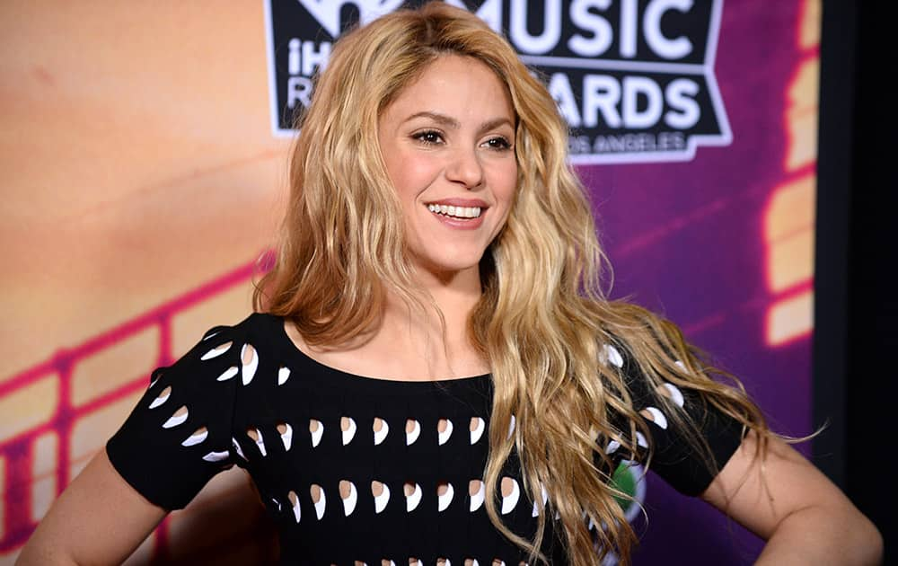 Shakira poses in the press room at the iHeartRadio Music Awards at the Shrine Auditorium in Los Angeles.