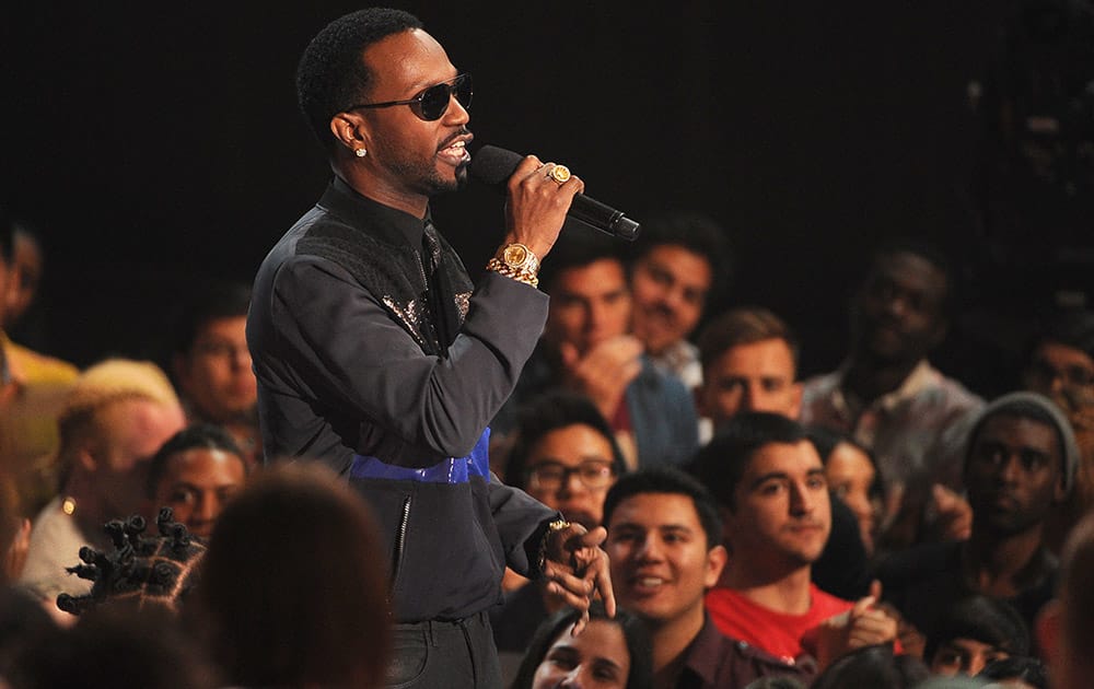 Juicy J speaks in the audience at the iHeartRadio Music Awards at the Shrine Auditorium in Los Angeles.