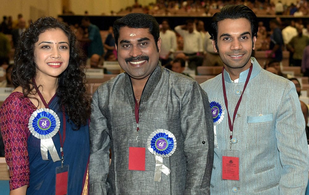 Best lead actress award winner Geetanjali Thapa with Best Actor (Shared) Suraj Venjaramoodu(C) and Raj Kumar poses for a group photo at the 61st National Film Awards 2013 function in New Delhi.