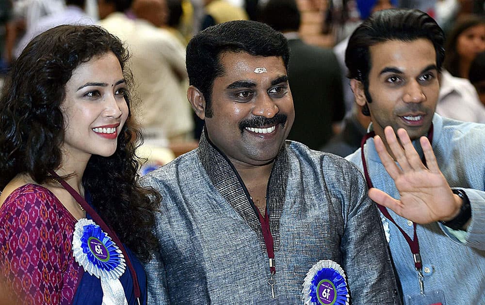 Best lead actress award winner Geetanjali Thapa with Best Actor (Shared) Suraj Venjaramoodu(C) and Raj Kumar poses for a group photo at the 61st National Film Awards 2013 function in New Delhi.