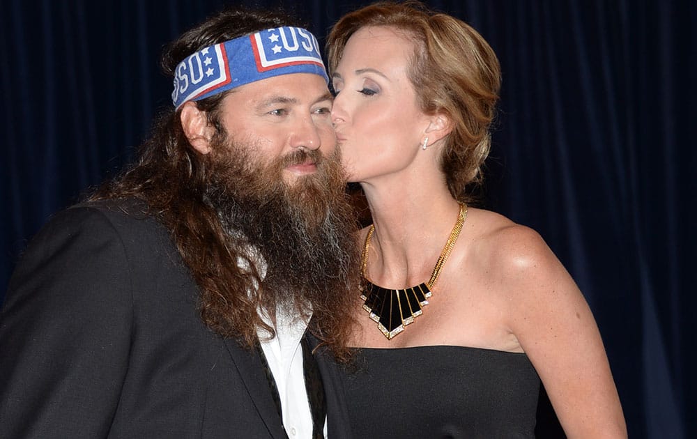 Willie Robertson, left, and Korie Robertson arrive at the White House Correspondents' Association Dinner at the Washington Hilton Hotel, in Washington.