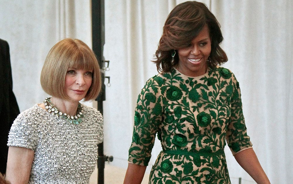 First lady Michelle Obama, right, and Vogue editor Anna Wintour appear at a dedication ceremony for the Anna Wintour Costume Center, at the Metropolitan Museum of Art in New York. 