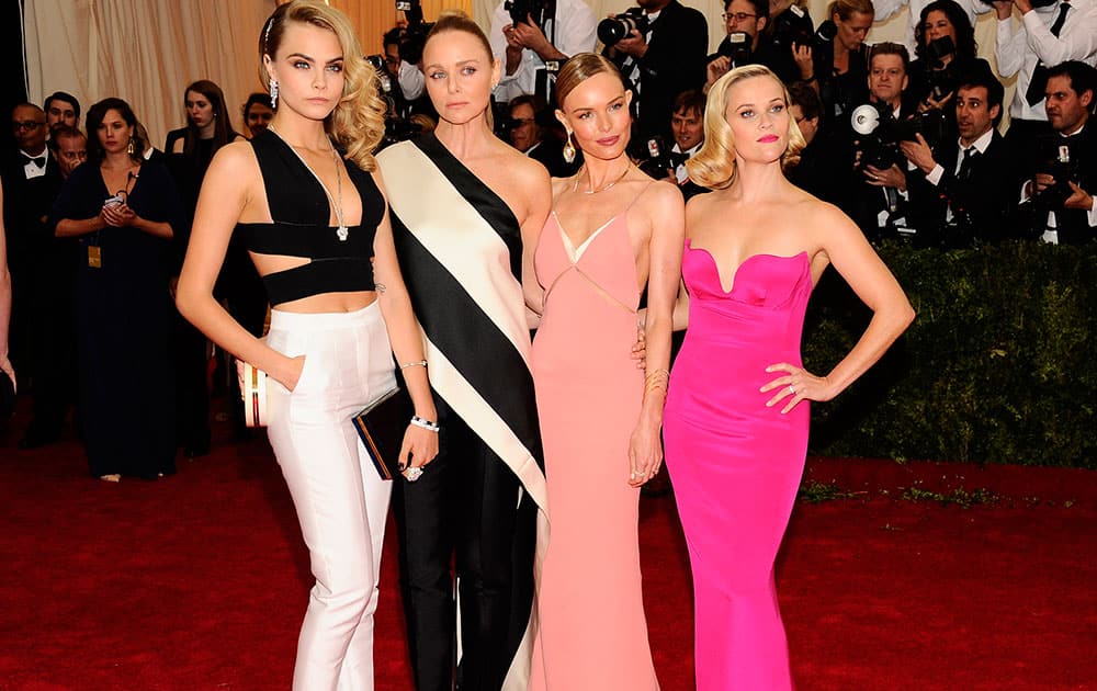 Cara Delevingne, from left, Stella McCartney, Kate Bosworth, and Reese Witherspoon attend The Metropolitan Museum of Art's Costume Institute benefit gala celebrating `Charles James: Beyond Fashion`in New York. 