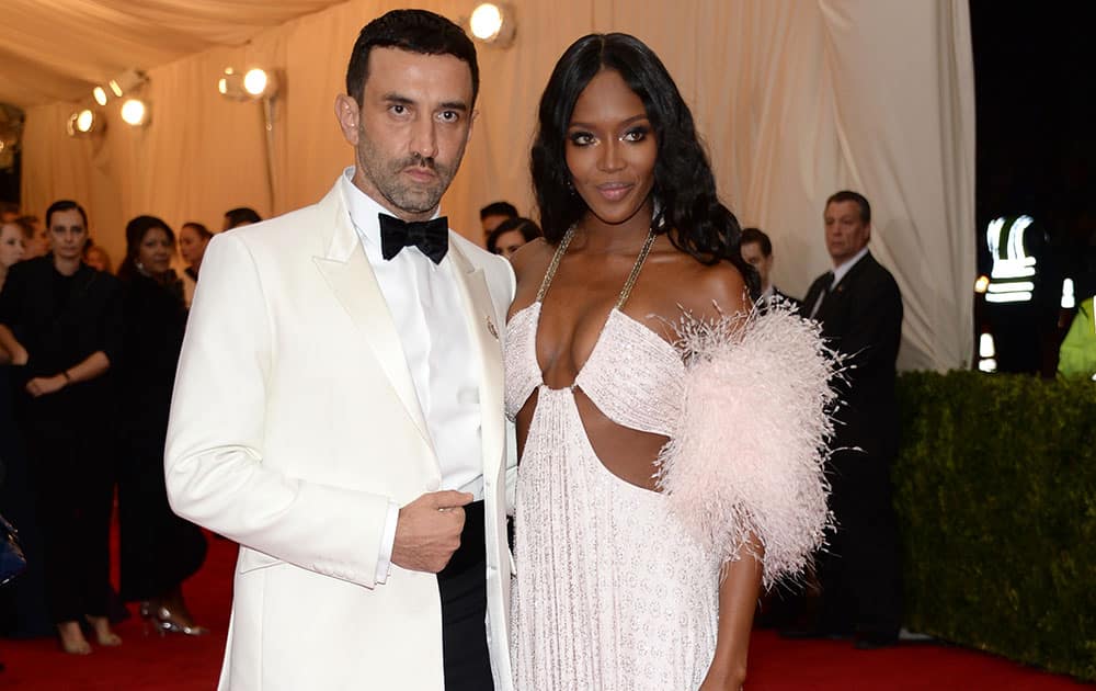 Riccardo Tisci, left, and Naomi Campbell attend The Metropolitan Museum of Art's Costume Institute benefit gala celebrating `Charles James: Beyond Fashion`in New York.