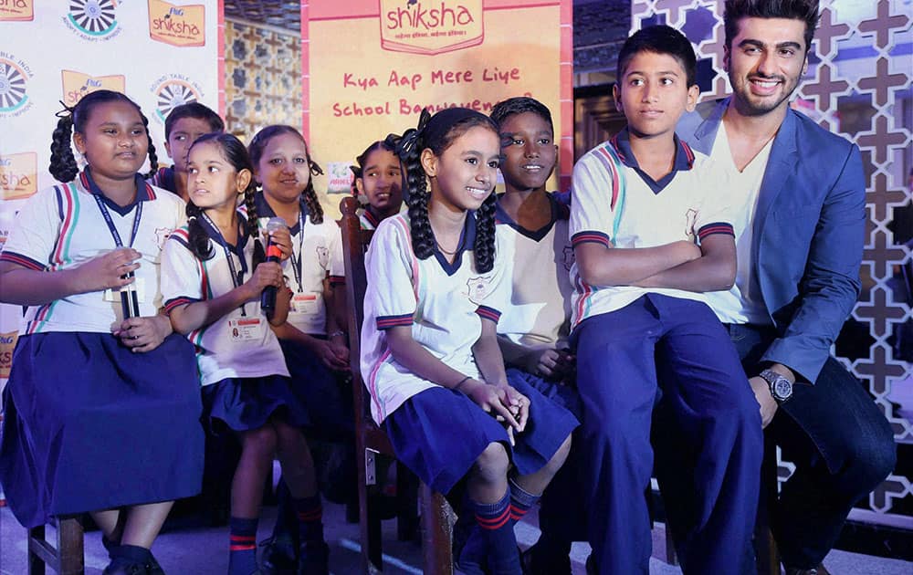 Bollywood actor Arjun Kapoor with underprivileged children at an event in Mumbai.