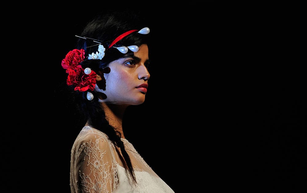 A model wears a creation from Victorio & Lucchino during Barcelona Bridal fashion week.