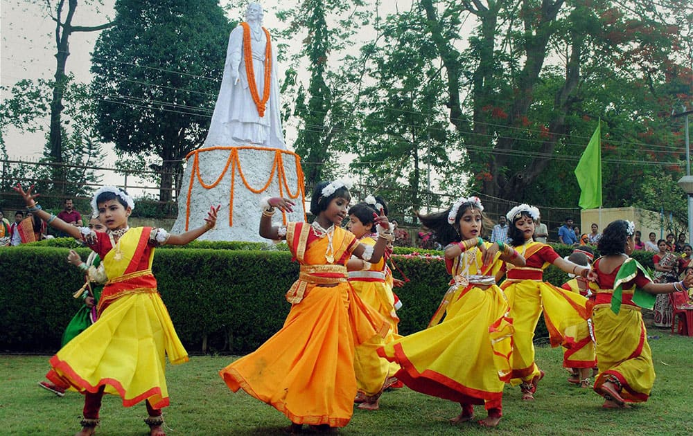 School children celebrate Rabindranath Tagore's 153rd birth anniversary celebrations in Agartala.