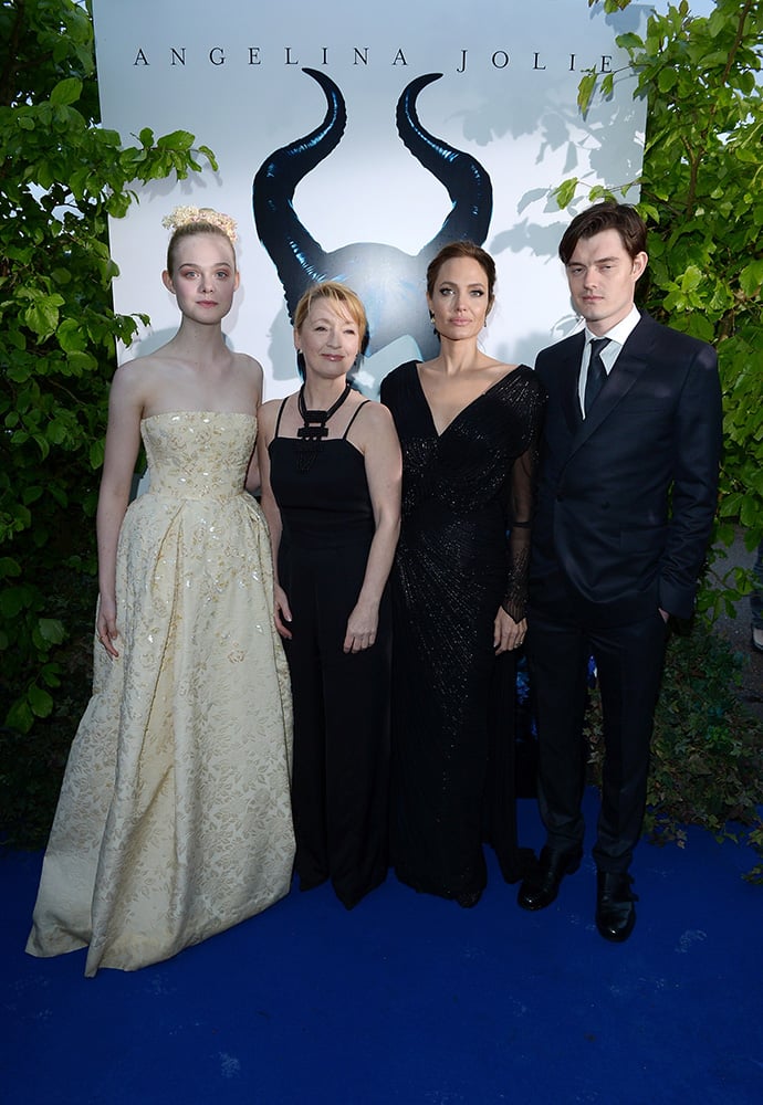 Actors Elle Fanning, Leslie Manville, Angelina Jolie and Sam Riley arrive for the Maleficent exhibit in Kensington Gardens, London.