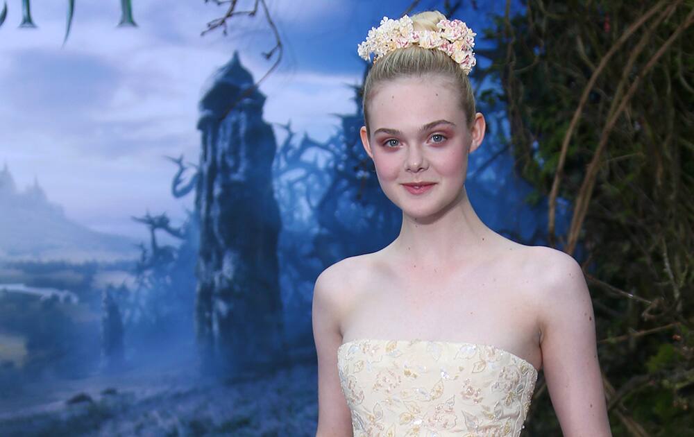 Actress Elle Fanning arrives for the Maleficent exhibit in Kensington Gardens, London.