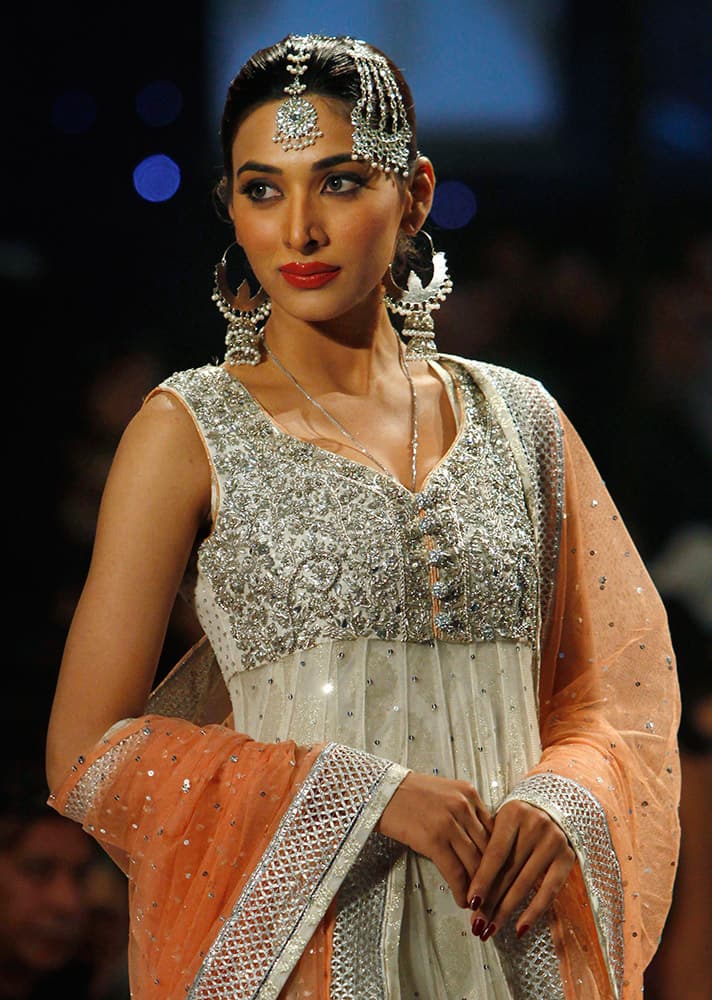 A model presents creation by designer Zainb Chottani during a Bridal Couture Fashion show Karachi, Pakistan.