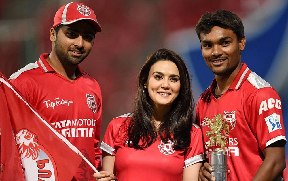 Kings XI Punjab’s Co-owner Priety Zinta with players Sandeep Sharma and Shivam Sharma celebrating their win against Royal Challengers Bangalore in the IPL match at Chinnaswamy Stadium in Bengaluru.