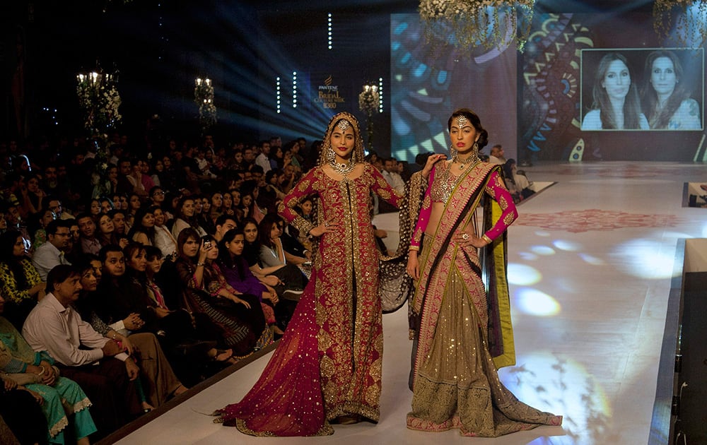 Model present creations by Fashion Power designing institute on the second day of Bridal Couture Week in Karachi, Pakistan.