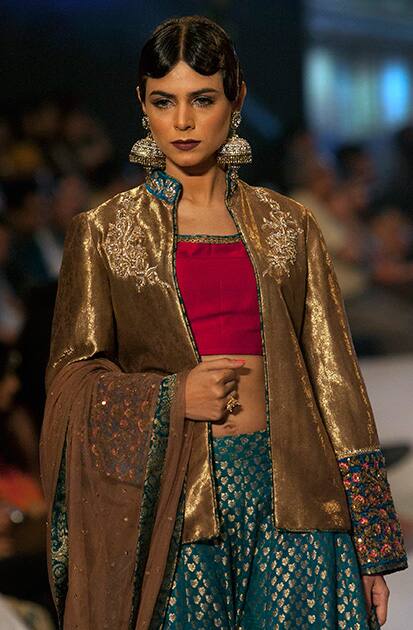 A model presents a creation by designer Zaheer Abbas on the second day of Bridal Couture Week in Karachi, Pakistan.