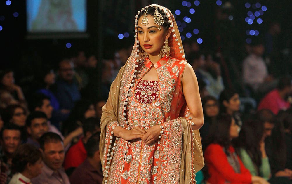 A model presents creation by designer Zainb Chottani during a Bridal Couture Fashion show in Karachi, Pakistan.