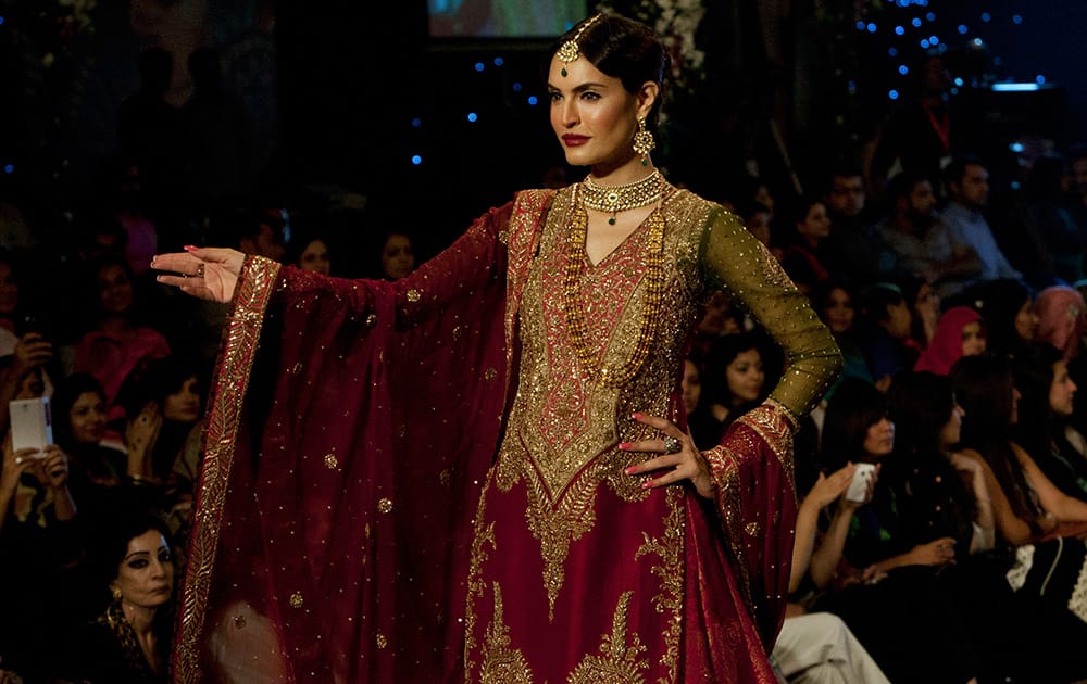 A model presents a creation by designer Zaheer Abbas on the second day of Bridal Couture Week in Karachi, Pakistan.