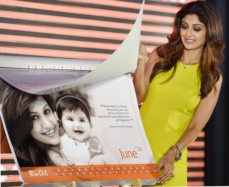 Bollywood actress Shilpa Shetty releases a calendar during an event to celebrate Mothers Day in Mumbai.