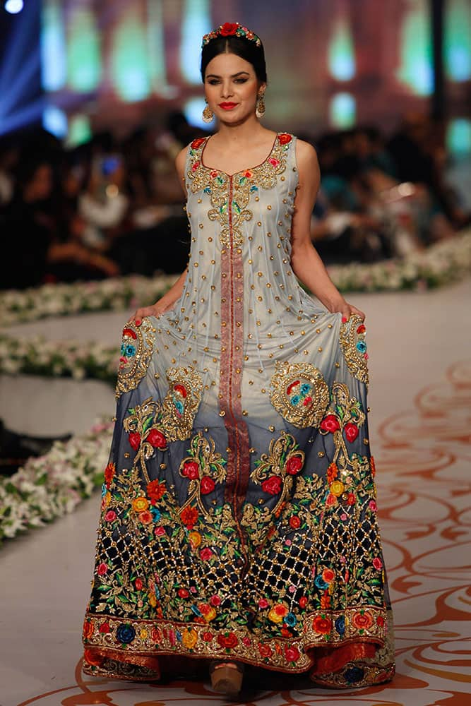 A model presents a creation by designer Tabassum Mughal on the third day of the Bridal Couture Week in Karachi.