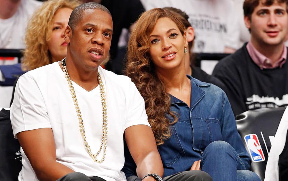 Entrepreneur and singer/songwriter Jay-Z and his wife, singer Beyonce, watch Game 4 of the Brooklyn Nets second-round NBA playoff basketball game against the Miami Heat at the Barclays Center in New York.