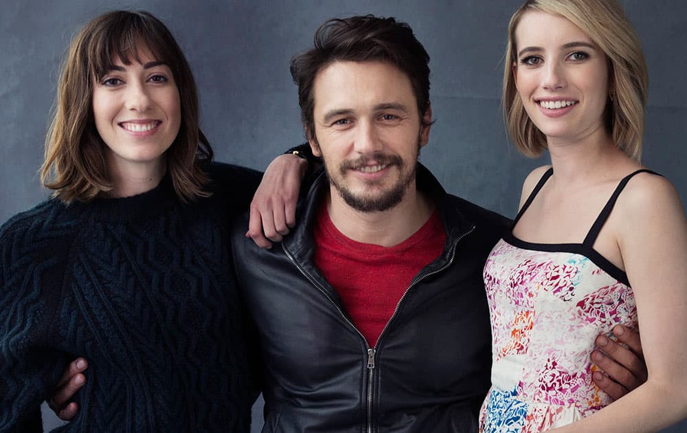 From left, writer-director Gia Coppola, actor, James Franco, and actress, Emma Roberts pose for a portrait in promotion of their film `Palo Alto,` in New York.