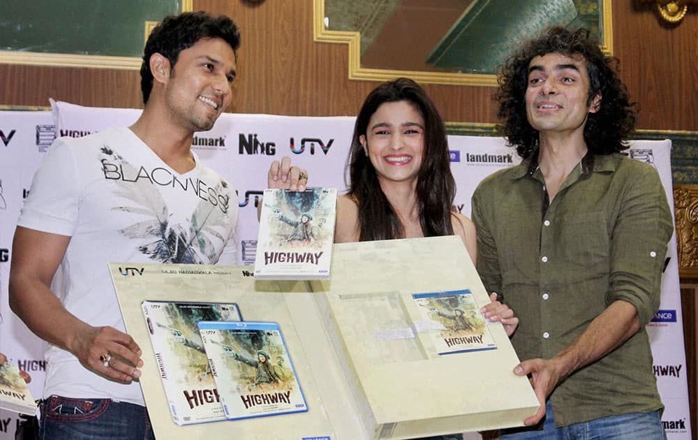 Bollywood director Imtiaz Ali with actors Alia Bhatt and Randeep Hooda at film Highways' DVD launch in Mumbai.