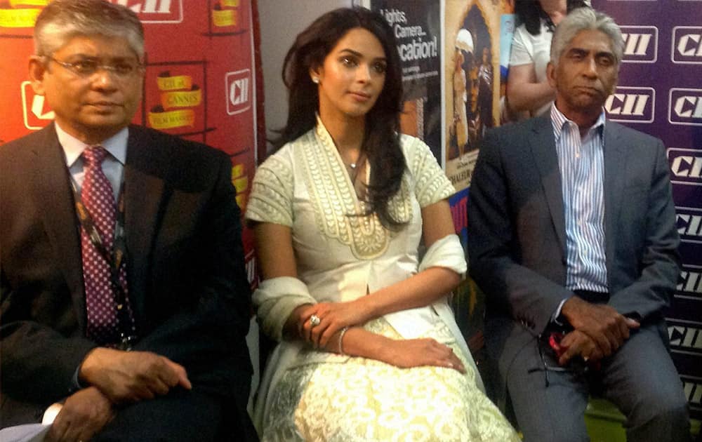 Arun Kumar Singh, Indian Ambassador to France, actress Mallika Sherawat, Ashok Amritraj, Chairman & CEO, Hyde Park Entertainment and Chairman, CII Cannes Initiatives and Bimal Julka, Secretary, Ministry of Information & Broadcasting at CII Pavilion in Cannes.