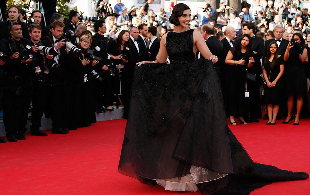 Actress Sonam Kapoor poses for photographers as she arrives for the screening of The Homesman at the 67th international film festival, Cannes, southern France.